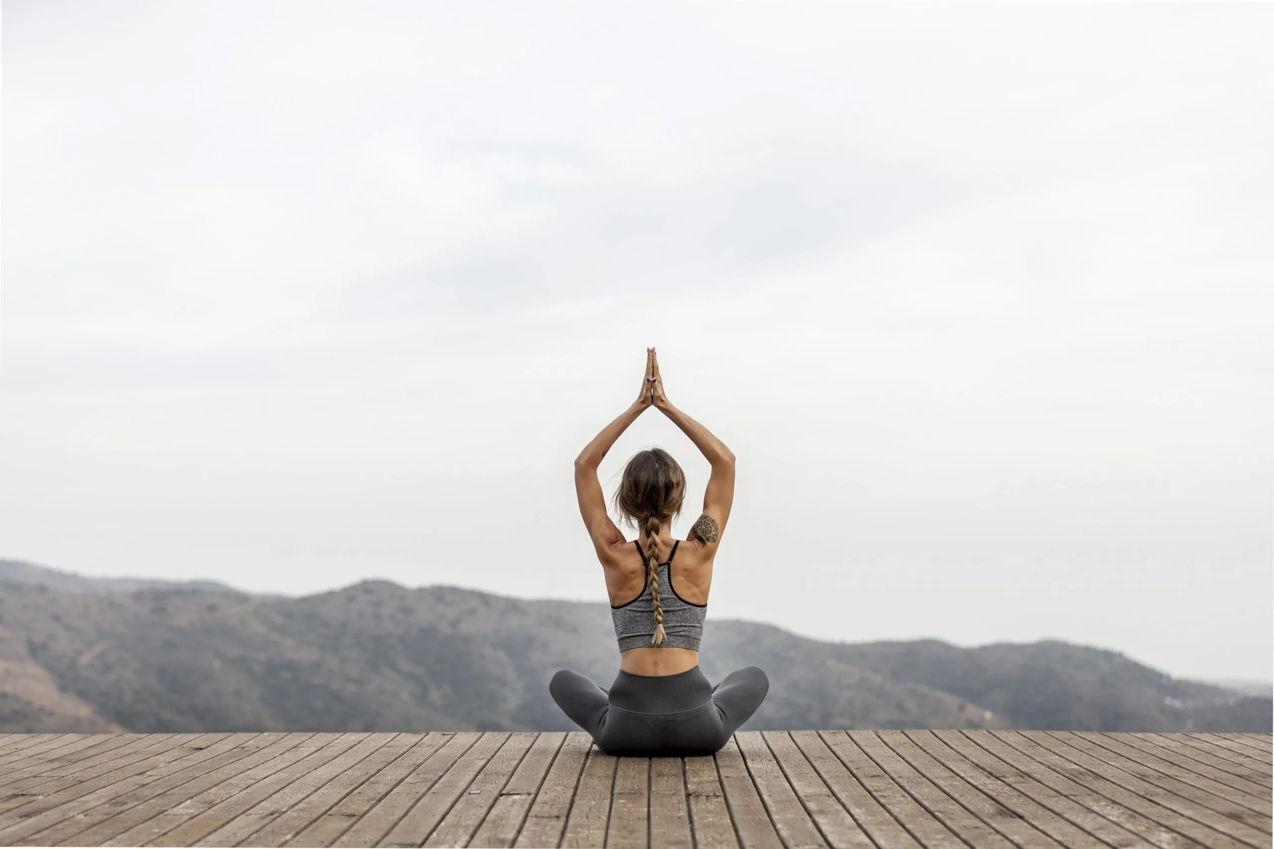 Woman practicing yoga as part of a balanced fitness routine